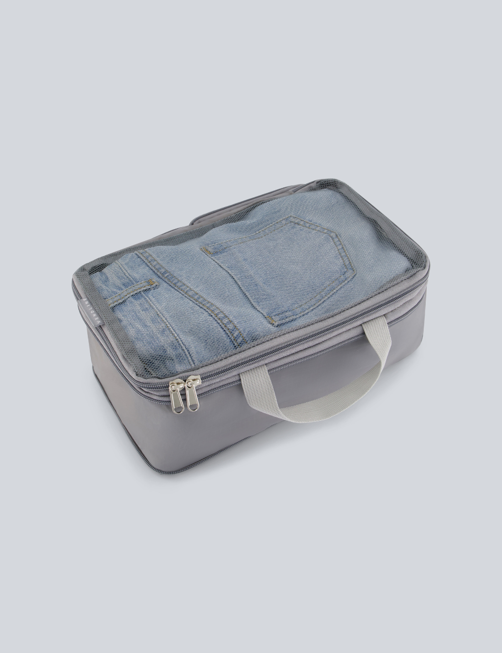 Compressible travel packing cubes set laid flat